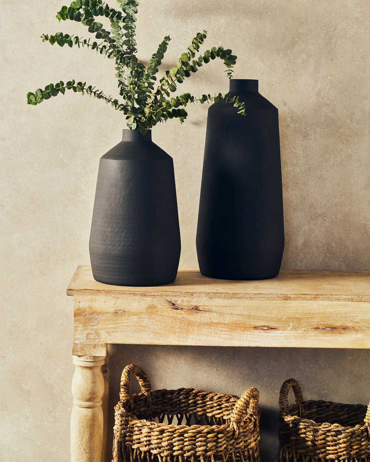 Nadi Vase - Large beside a smaller black vase on a wooden console.