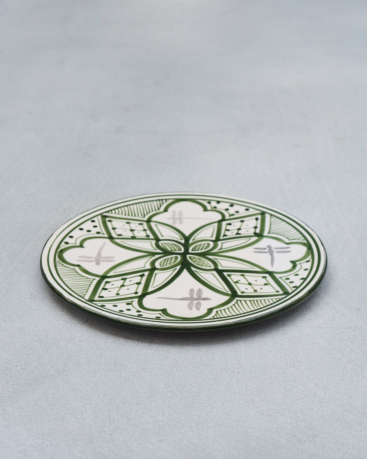 Mosaic Oasis Quarter Plate in green and white, angled on a grey surface.