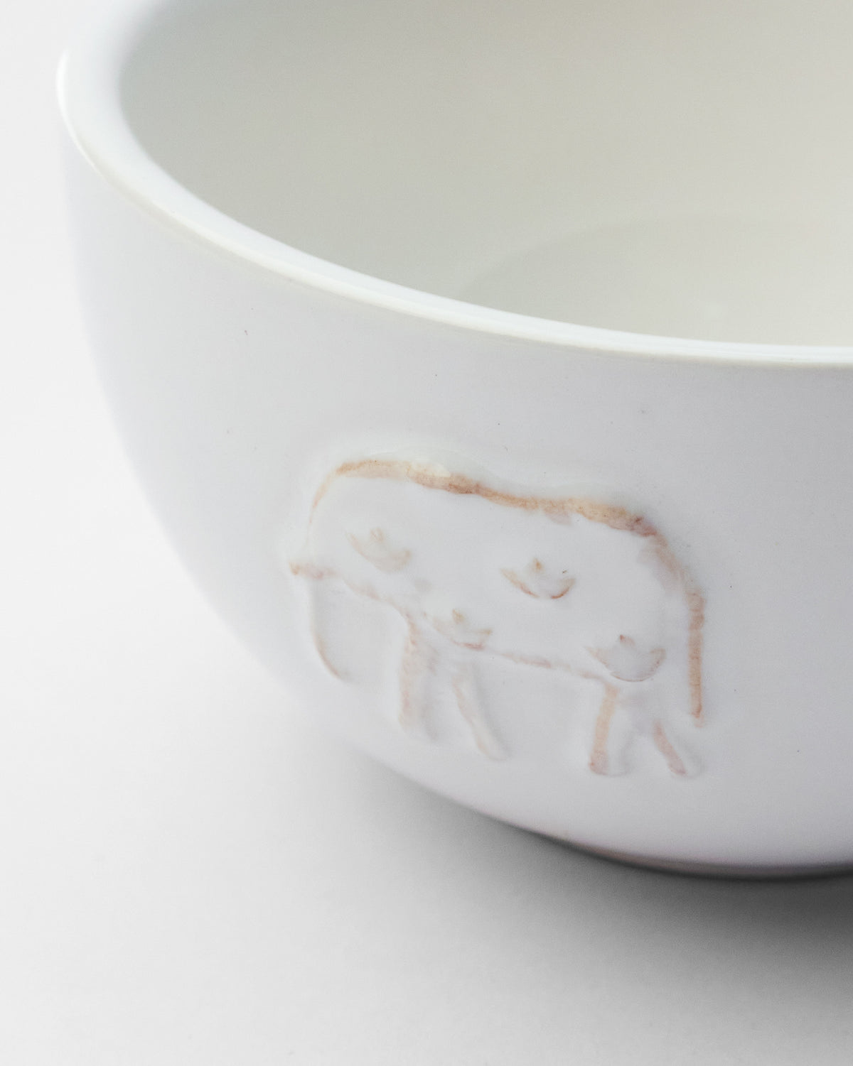 Close-up of Ele Palm Katori showing a raised elephant motif on its side.