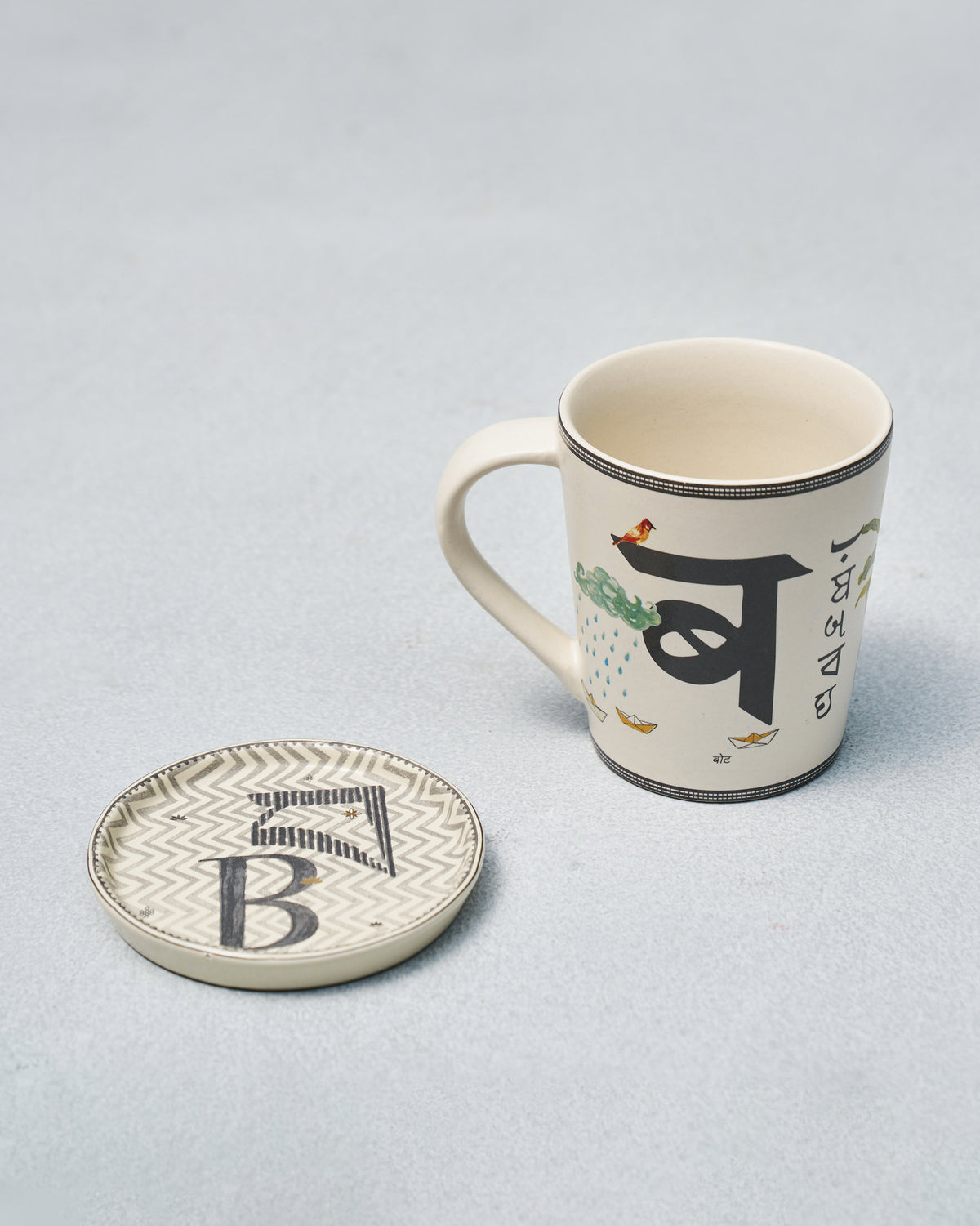B Alphabet mug with Devanagari ब illustration beside a letter B coaster.