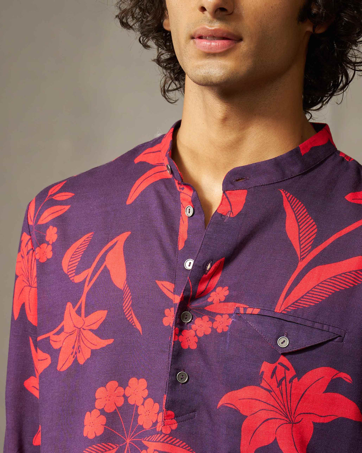 Close-up of the red floral print and band collar on a Fort Kurta.