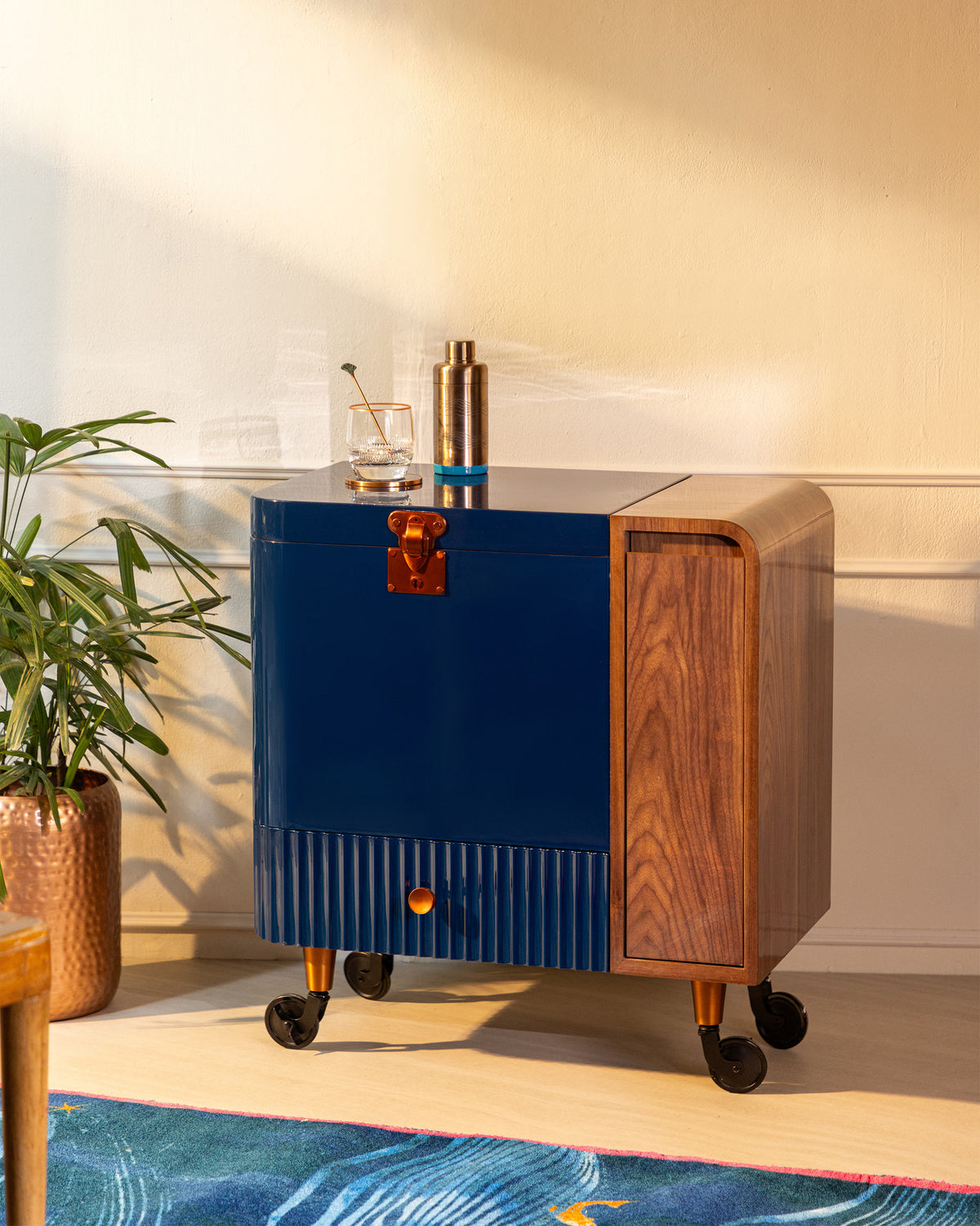 Twilight blue Contours of Time bar trolley with copper handles and a wood side.
