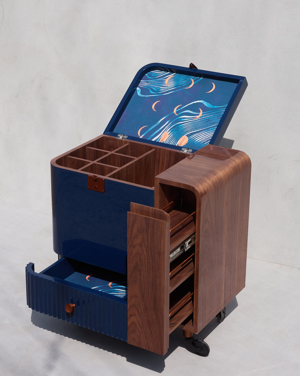 Open Contours of Time trolley with bottle cubbies, moon lining, and wood trays.