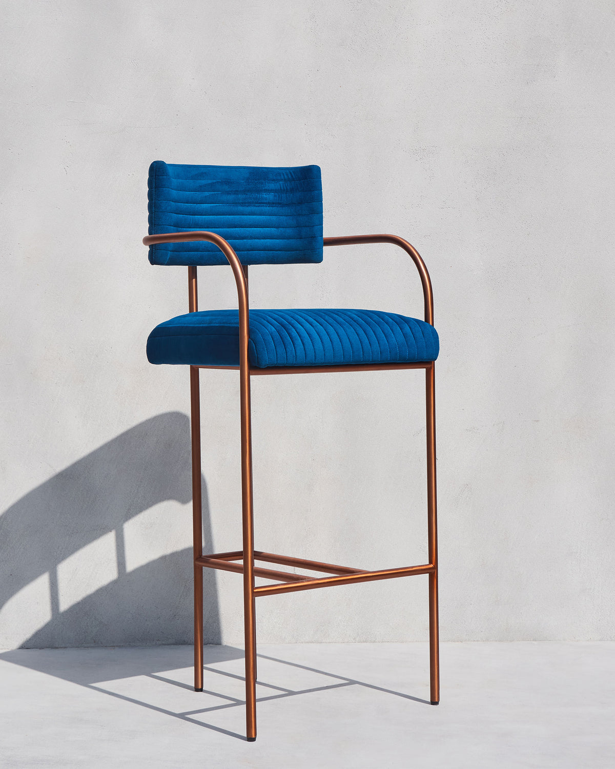 Blue Contours of Time high chair with a copper metal frame.