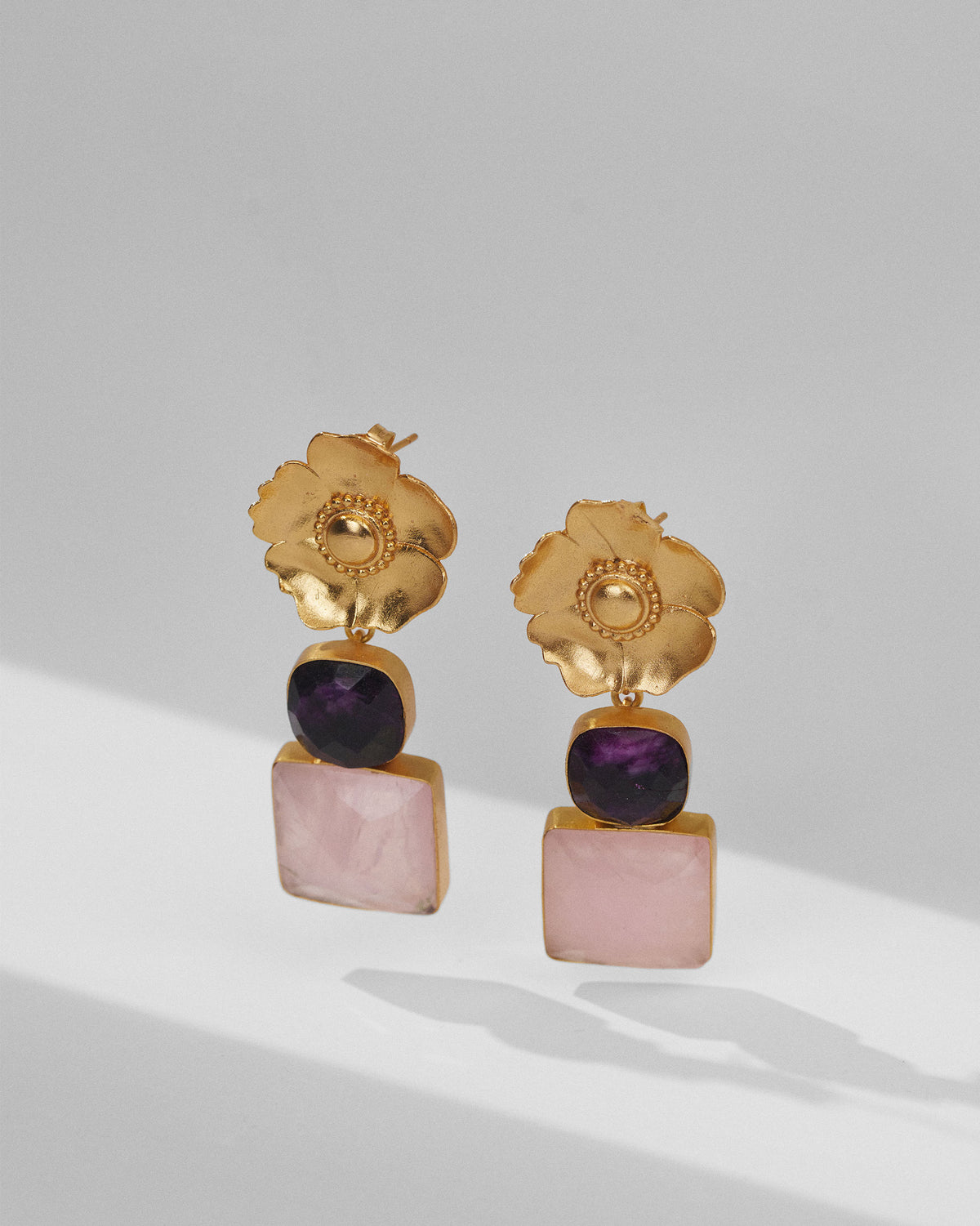 Gold dessert rose ruby drops showing purple and blush pink stones.