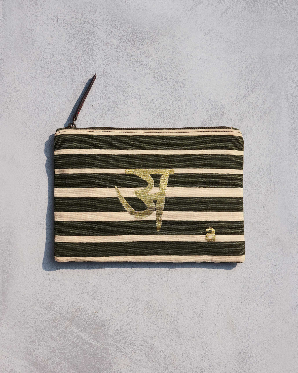 Olive and cream striped Alphabet A Pouch with a gold letter motif.