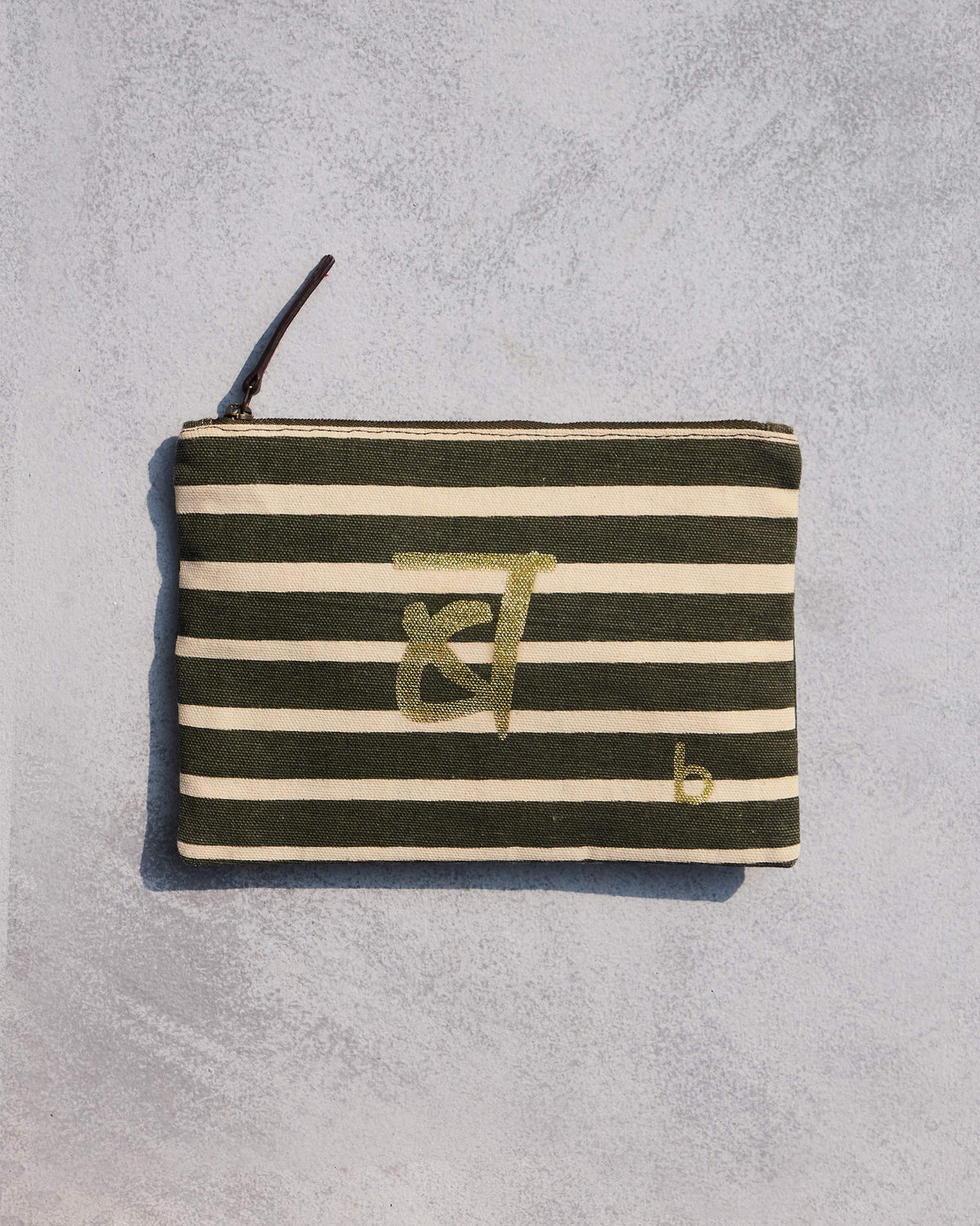 Olive and cream striped Alphabet B Pouch with a gold letter motif.