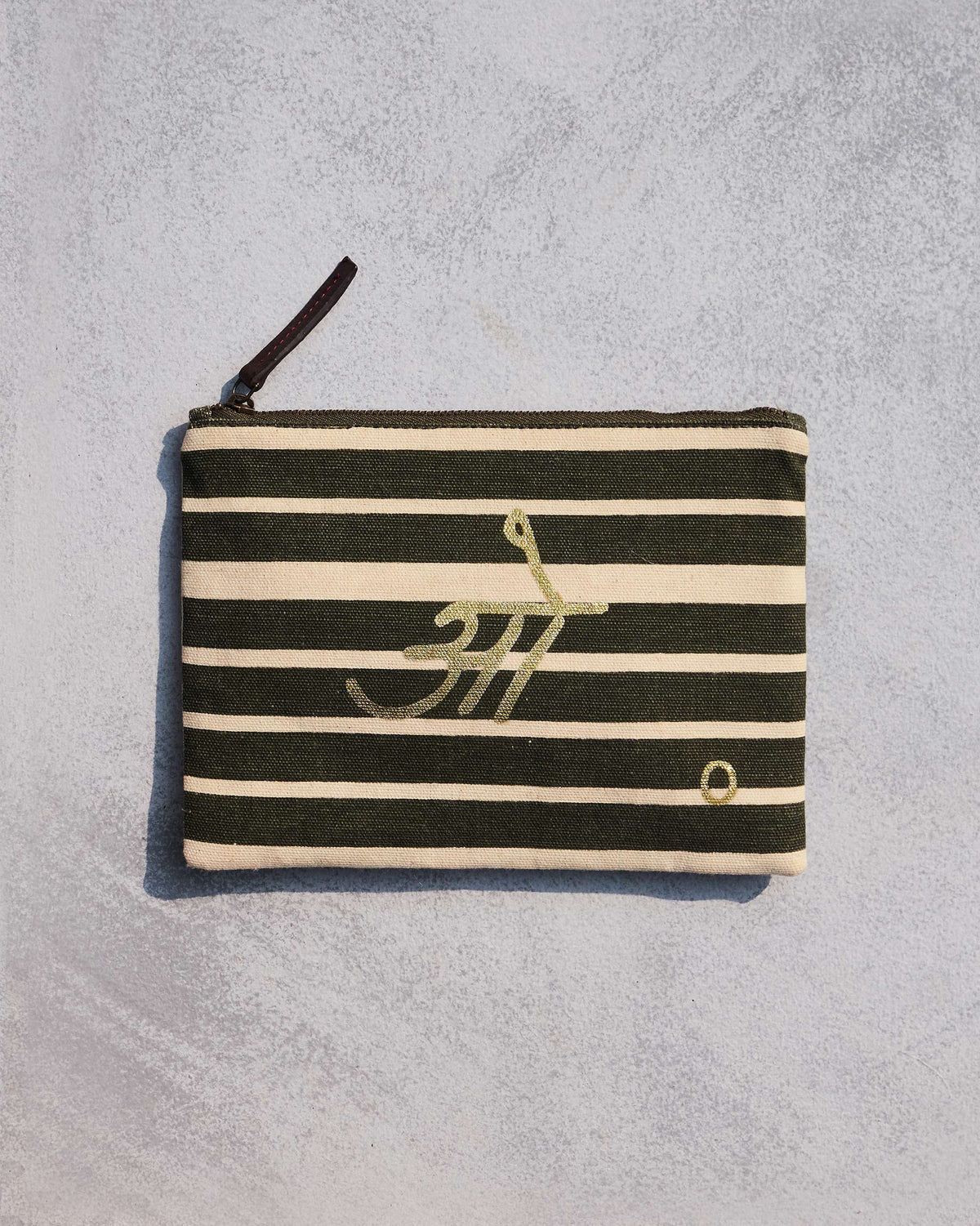 Alphabet O Pouch in olive and cream stripes with gold lettering.