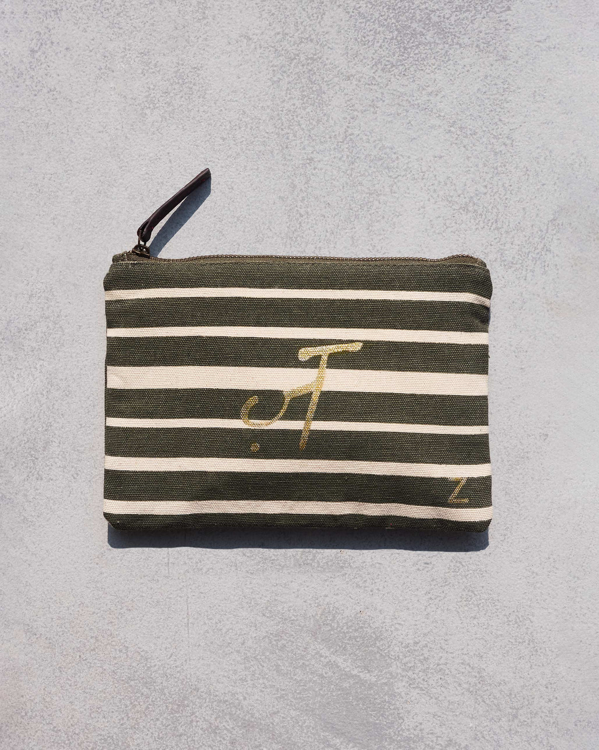 Alphabet Z Pouch in olive and cream stripes with gold lettering.