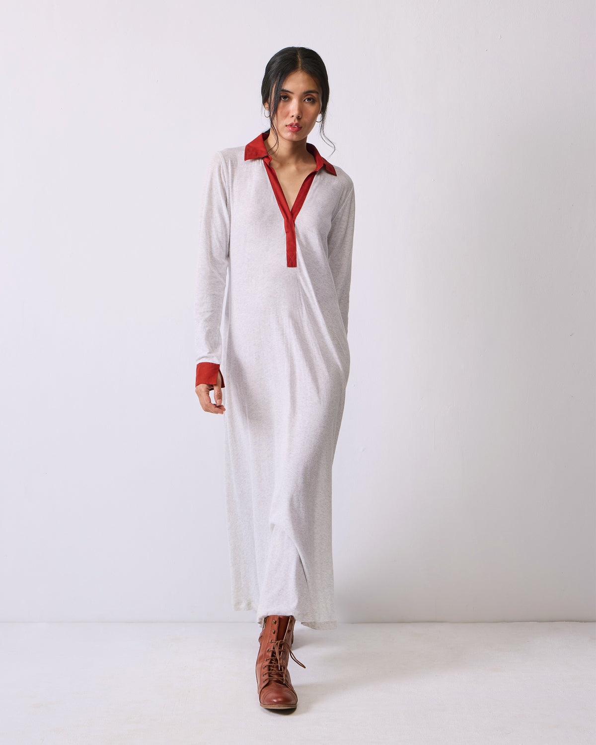 Person wearing a grey Autumn Dress with rust collar and cuffs.