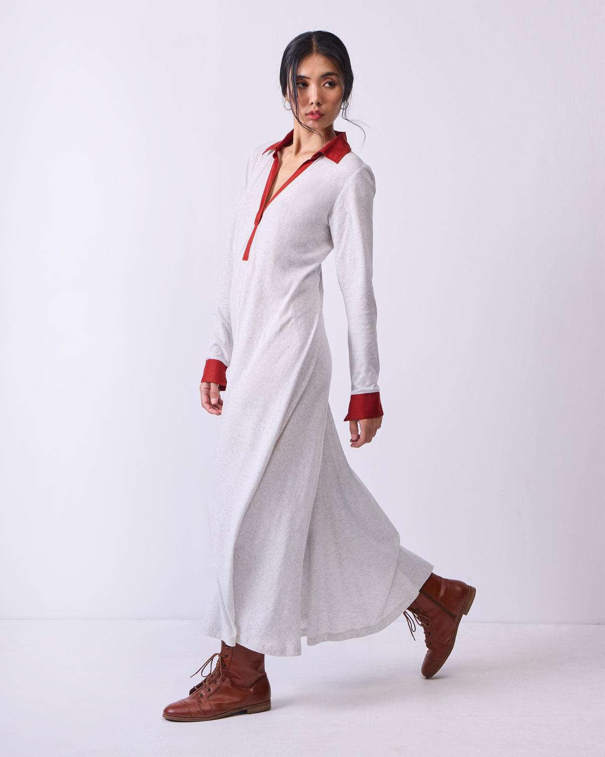 Grey Autumn Dress with rust accents worn at a three-quarter angle.
