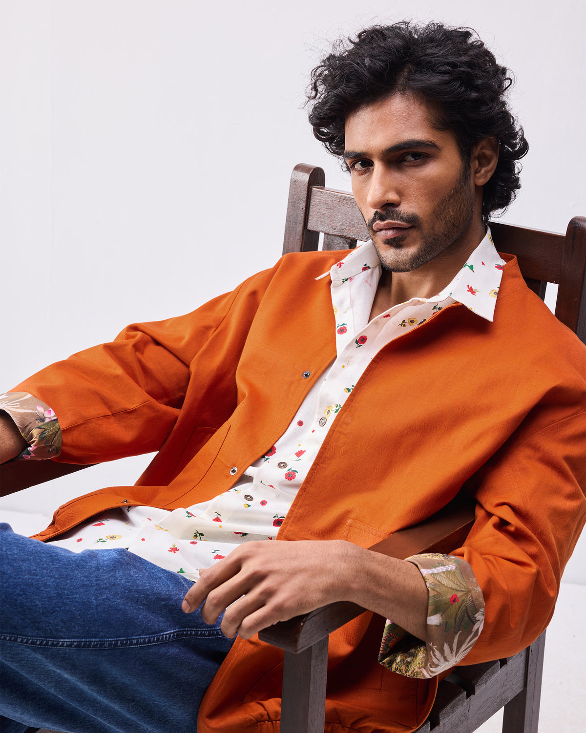 Rust Safar bomber with botanical cuff lining worn open.