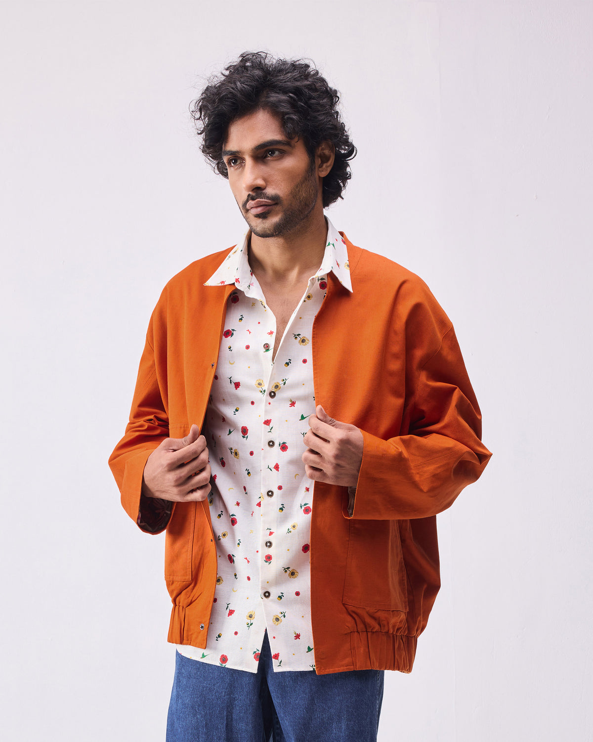 Rust Safar bomber worn open with an elasticated hem.