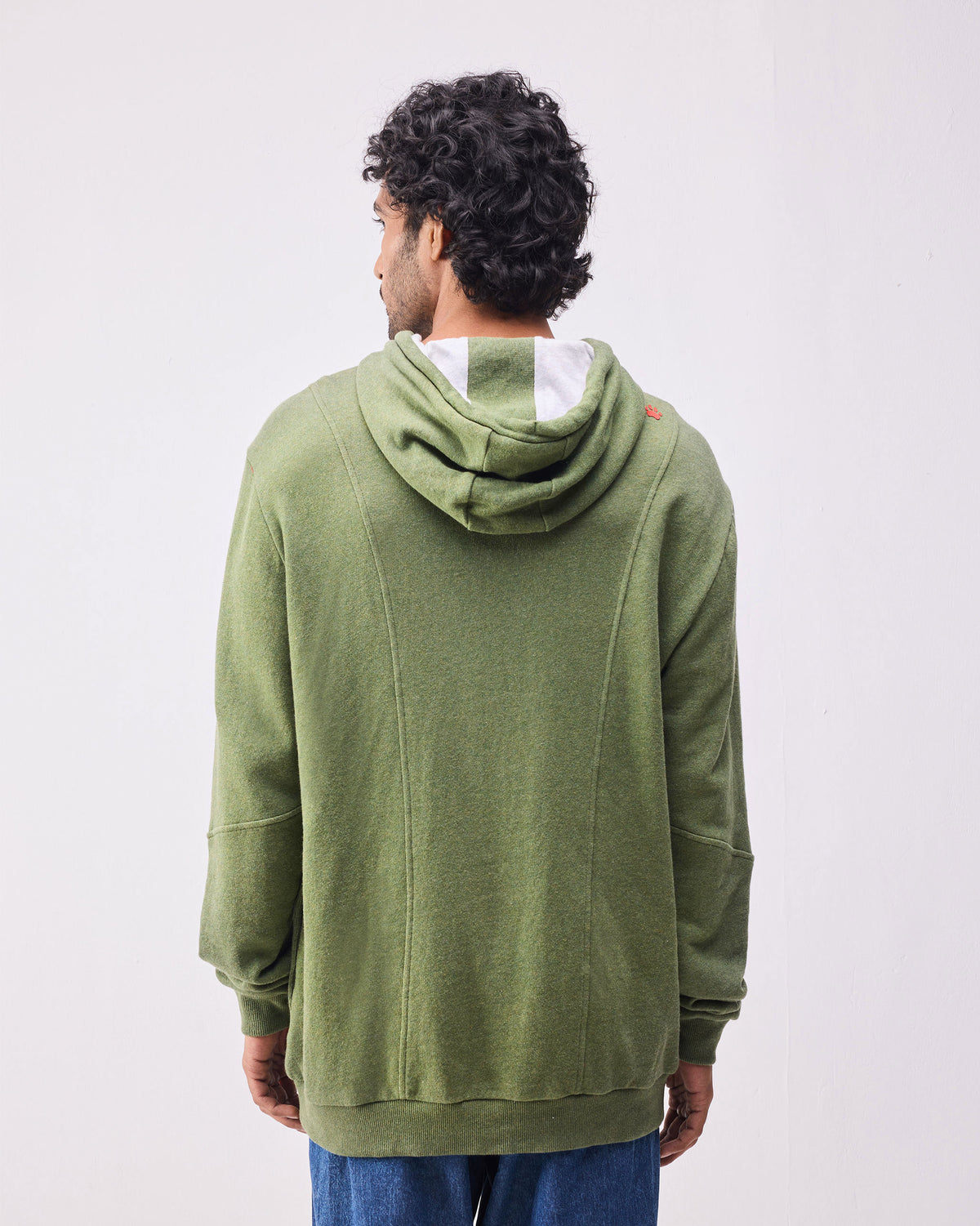 Back of an olive green Urban Sweatshirt with paneled seams.