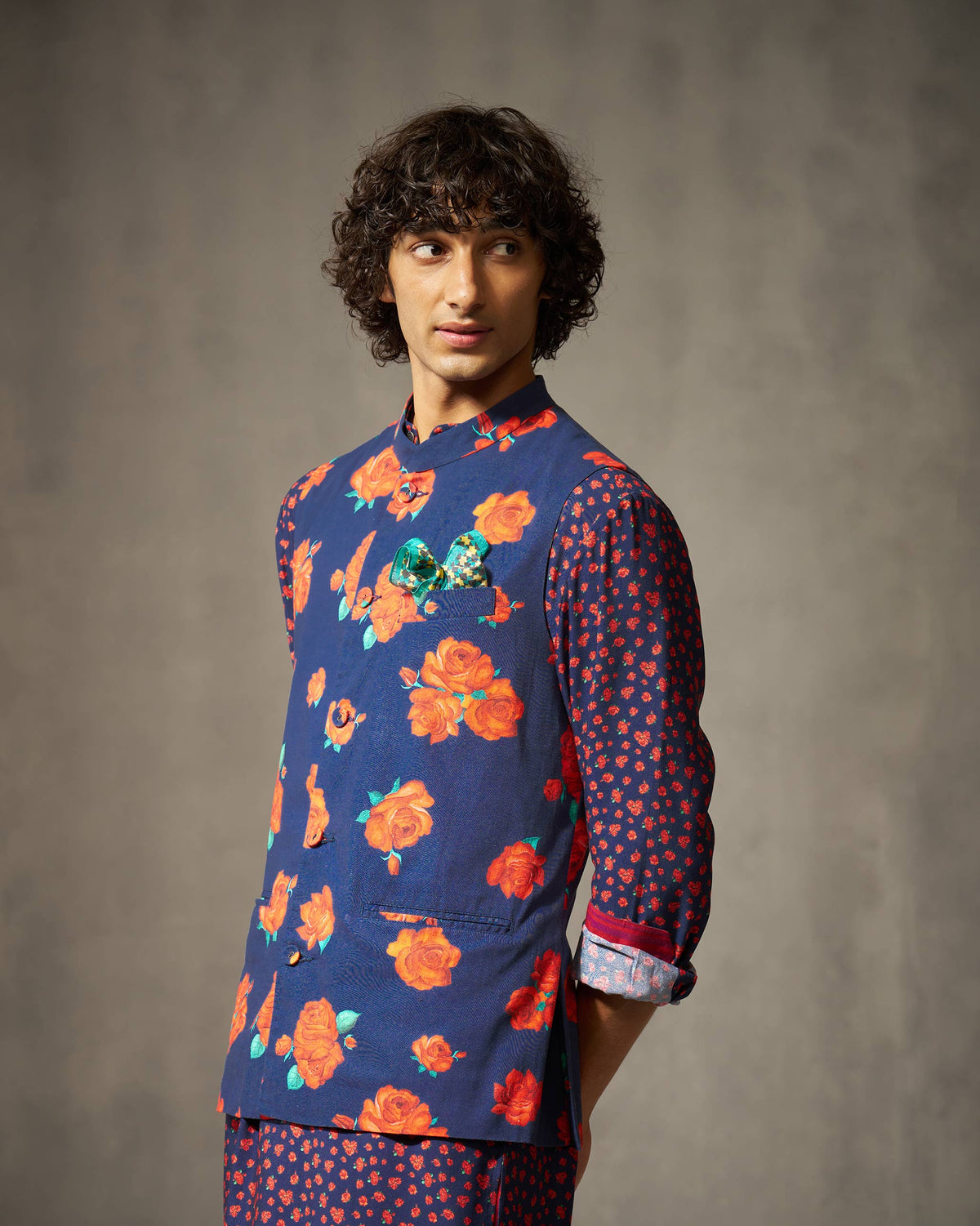 Navy Nehru jacket with red rose print worn at a three-quarter angle.