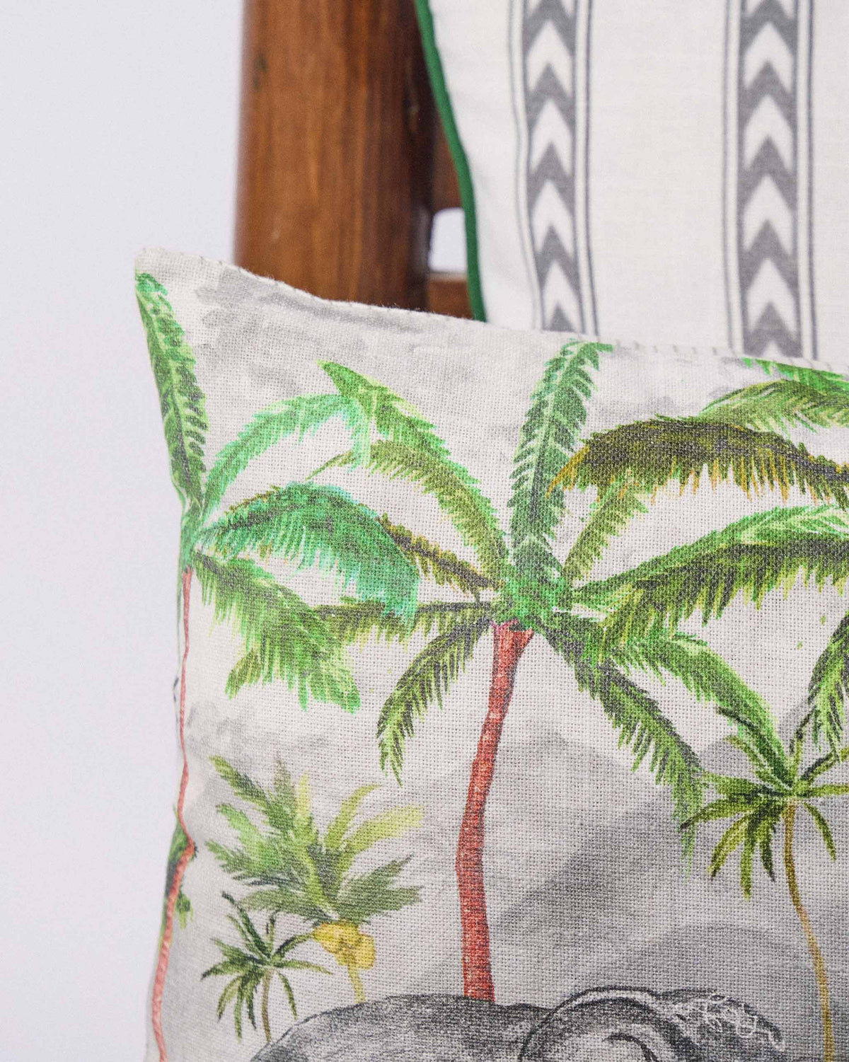 Close-up of the Ceylon Ele Lumbar Cushion Cover showing palm trees.