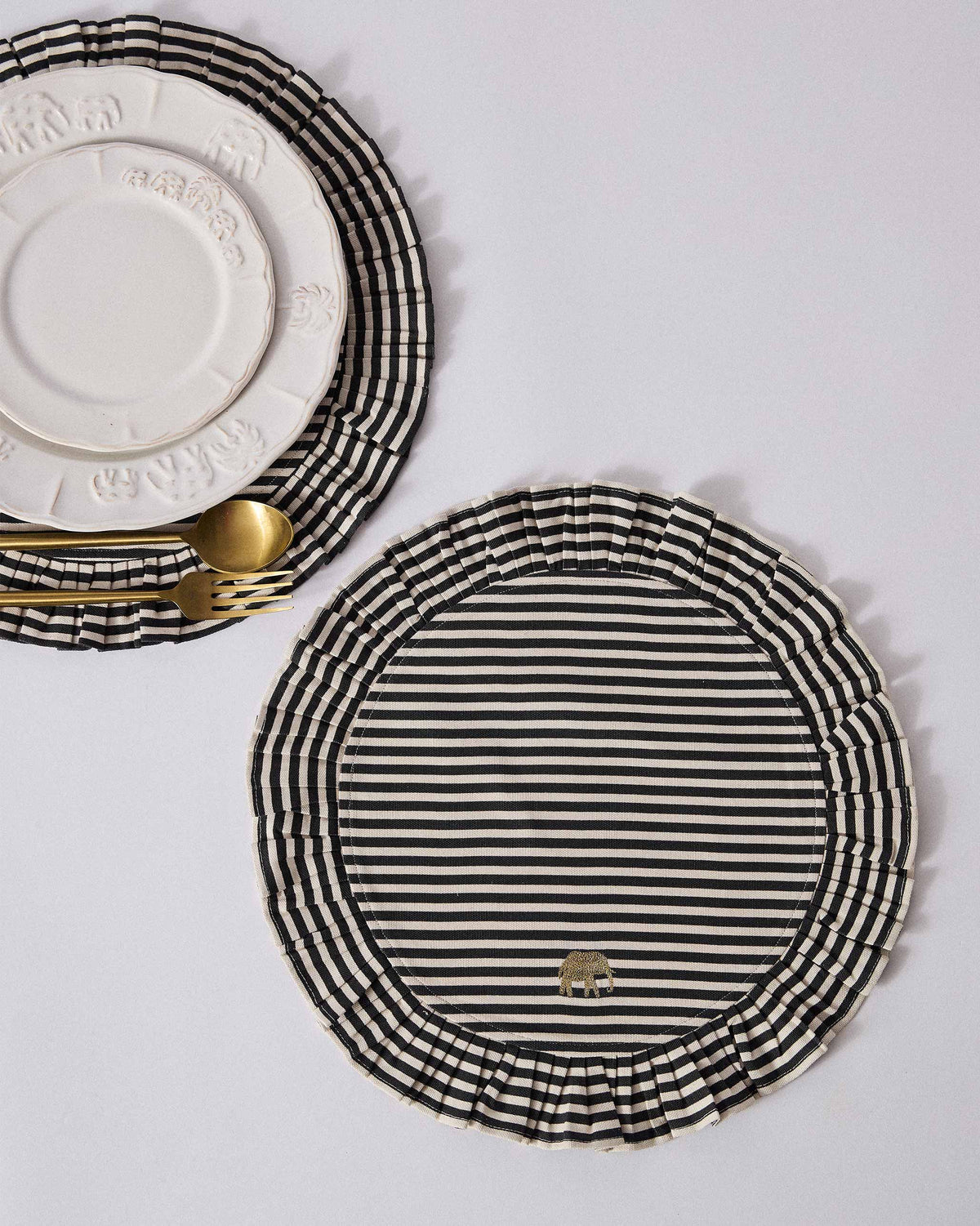 Candy Stripes placemat under plates beside a matching empty mat.