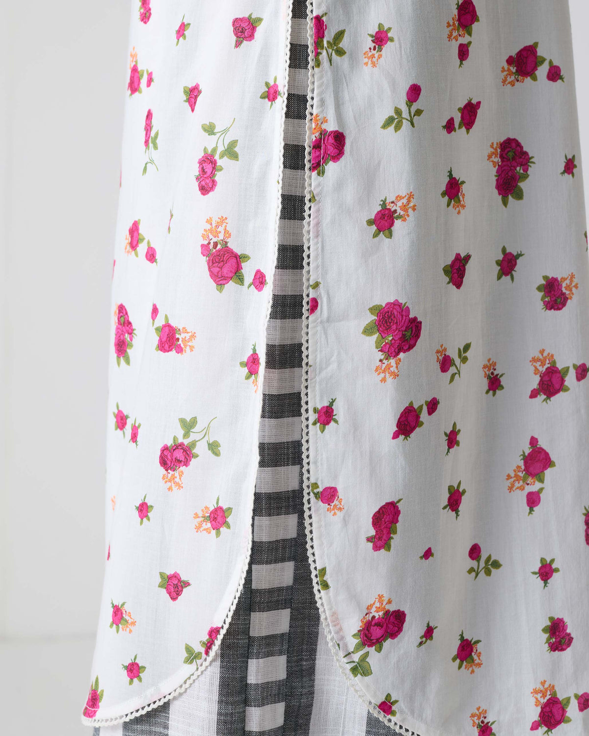 Close-up of lace trim along the hem of a fuchsia-print Vintage Camisole.
