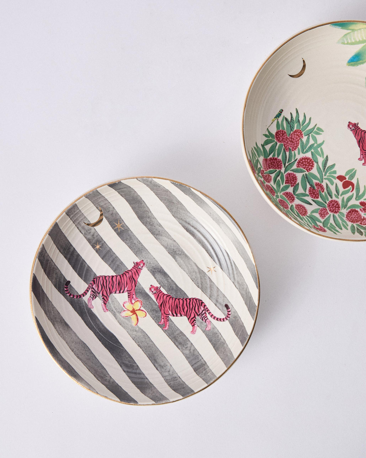 Ceylon Trail Shallow Bowls showing pink tigers on stripes and foliage.