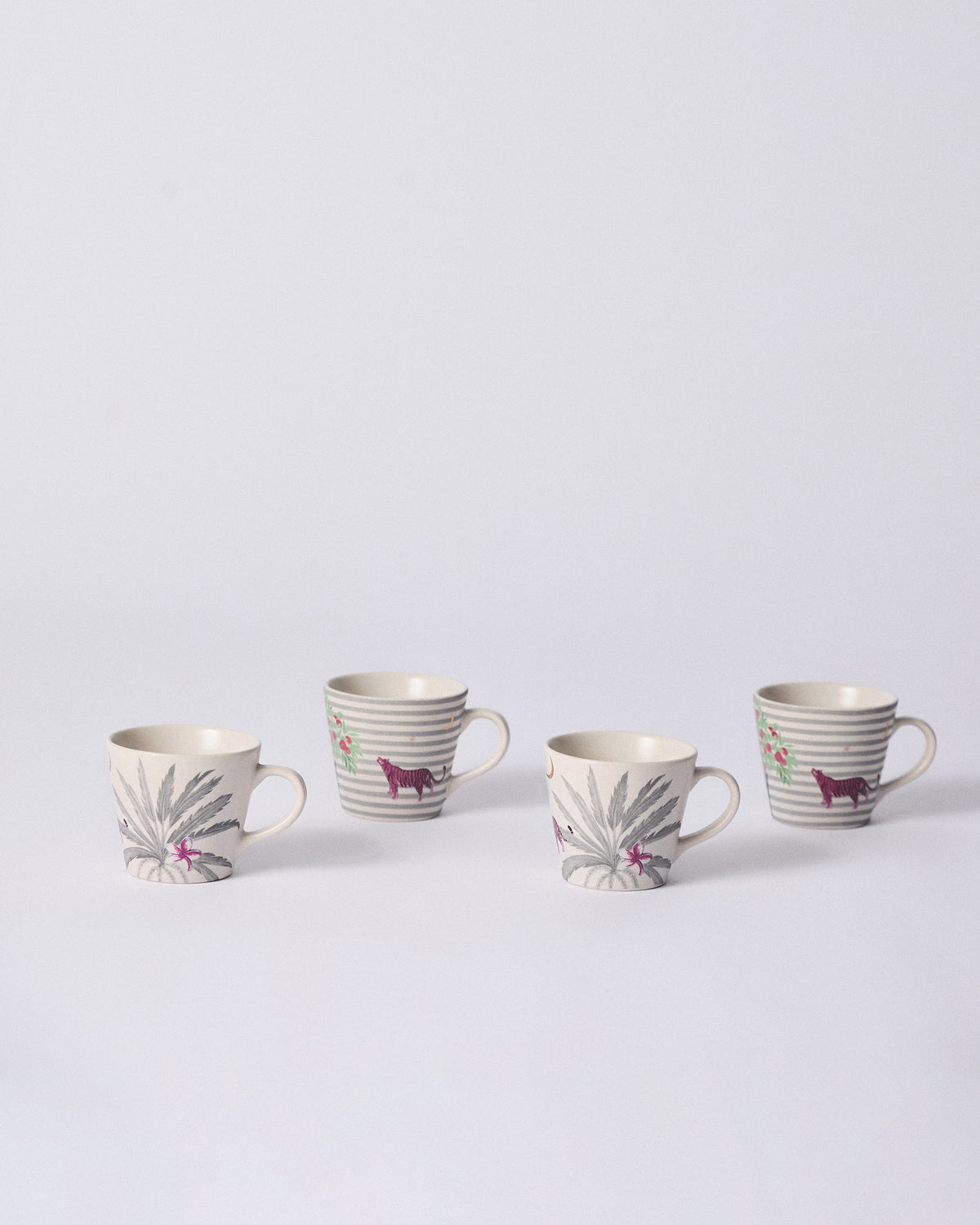 Four Ceylon Trail Espresso Mugs alternating palm fronds and pink tigers.