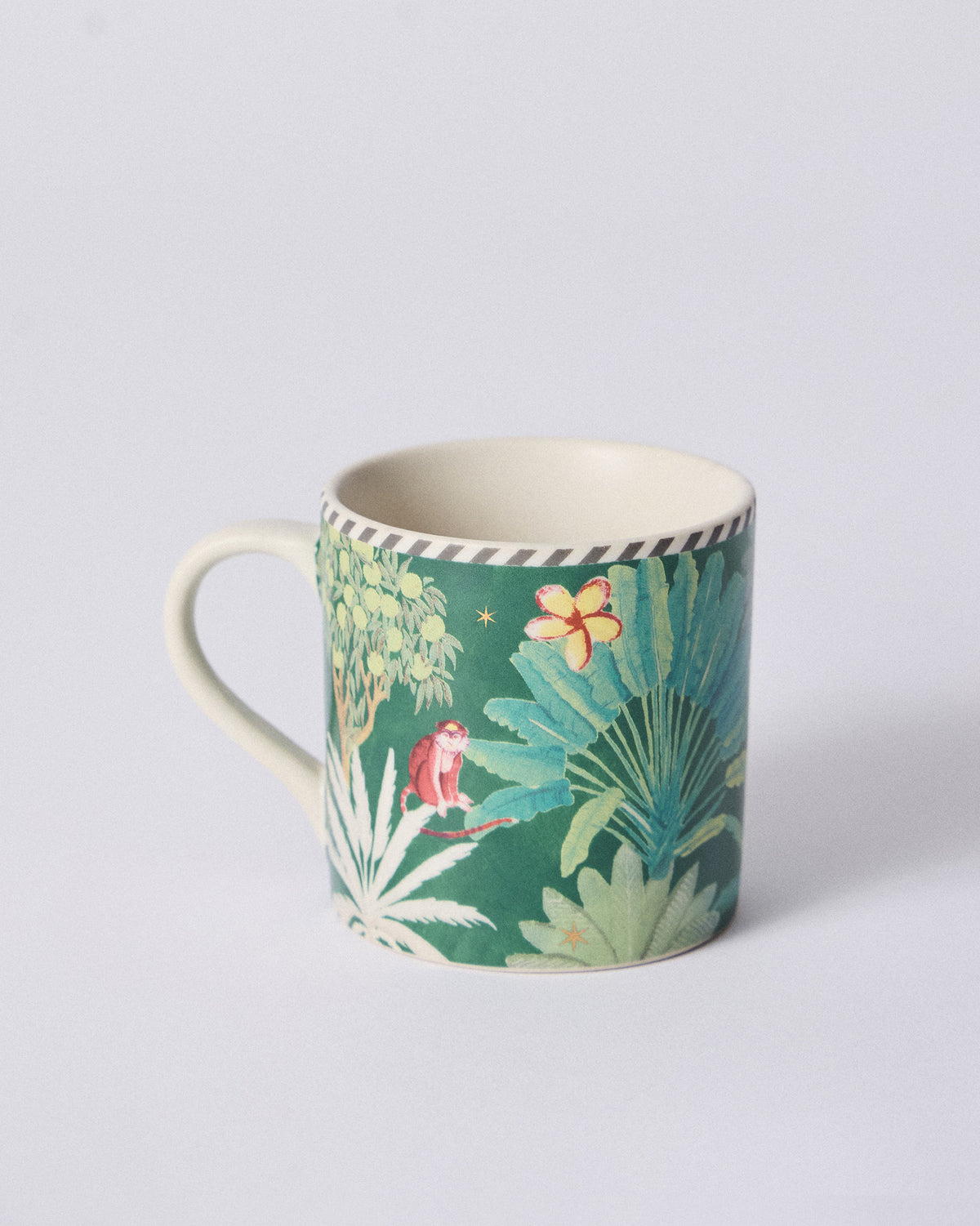 Ceylon Trail Straight Mug with a red monkey beside palm leaves.