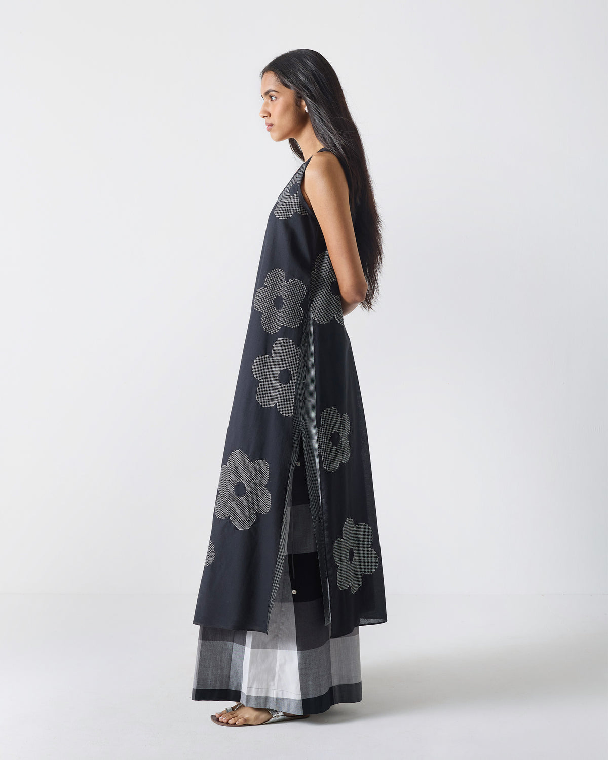 Side view of a black Double Layer Kurta with a high side slit.
