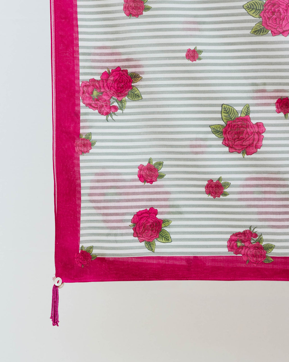 Close-up of Stripes and Flowers Scarf corner showing pink roses and a pink border.