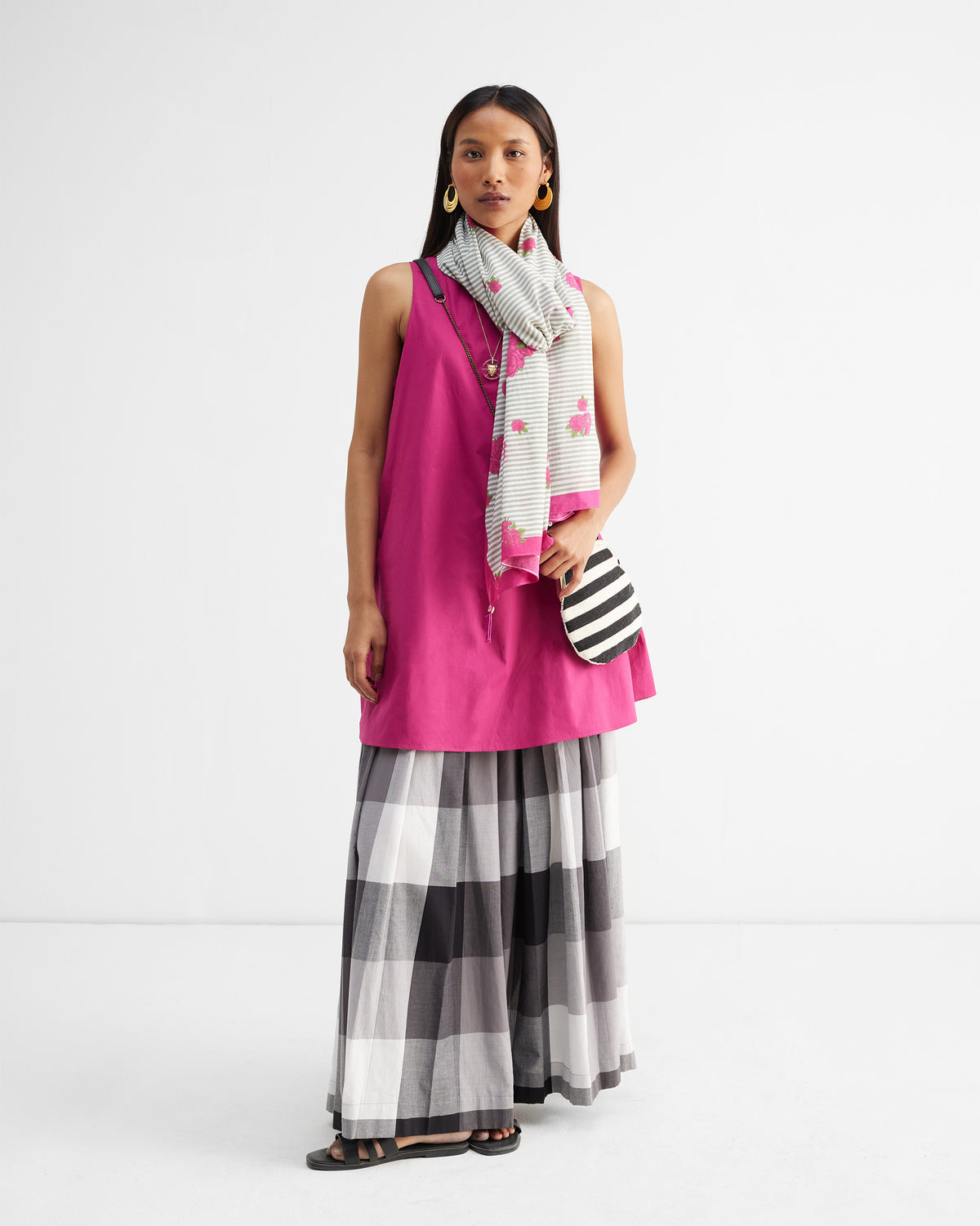 Person wearing a Stripes and Flowers Scarf draped over the shoulder.