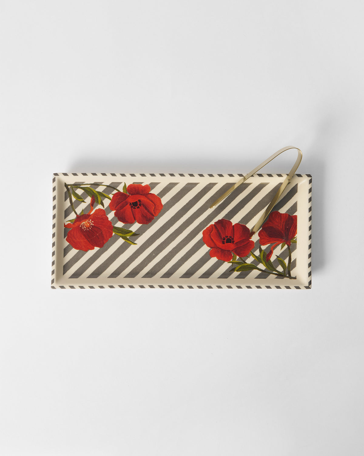 Striped Poppy cookie tray with red poppies and gold serving tongs.
