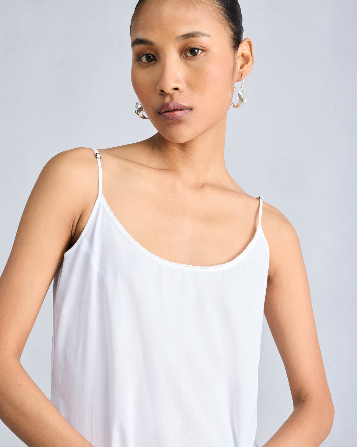 White Vintage Camisole with lace along the scoop neckline.