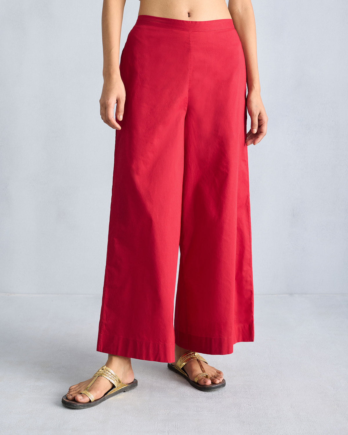 Person wearing red Basic pyjamas with a wide A-line flare.