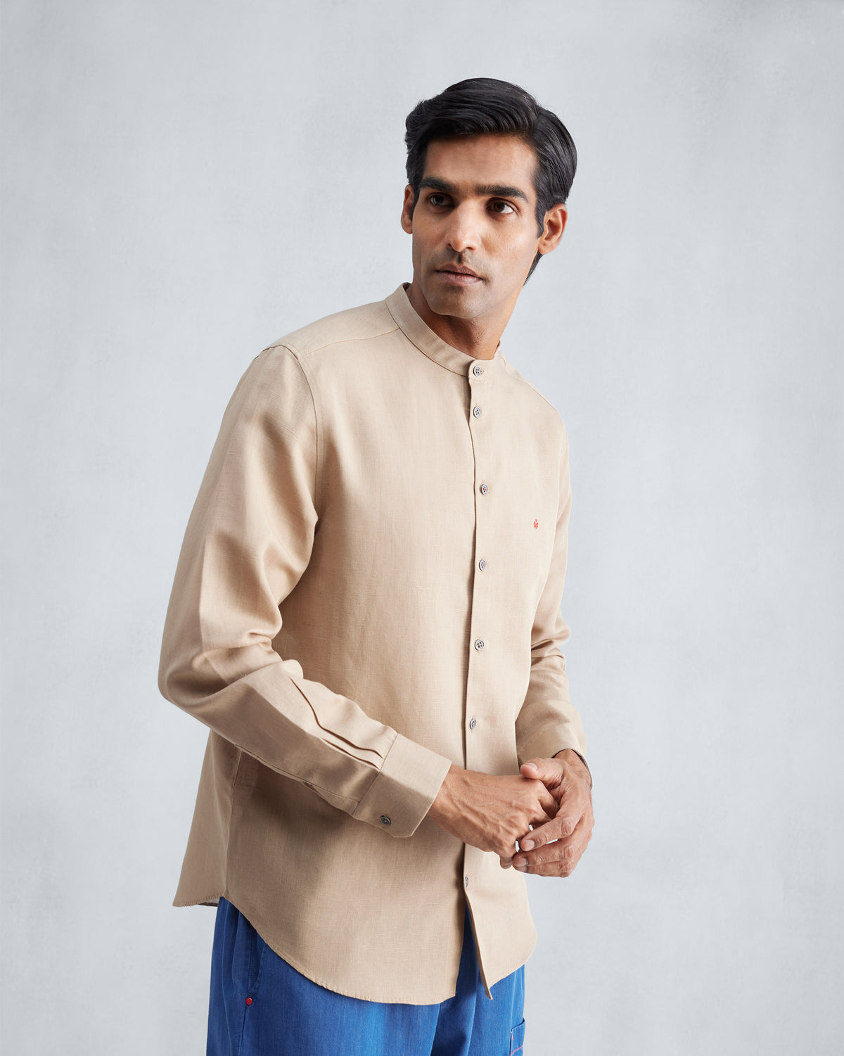 Beige Nawab shirt with a Nehru collar worn at a three-quarter angle.