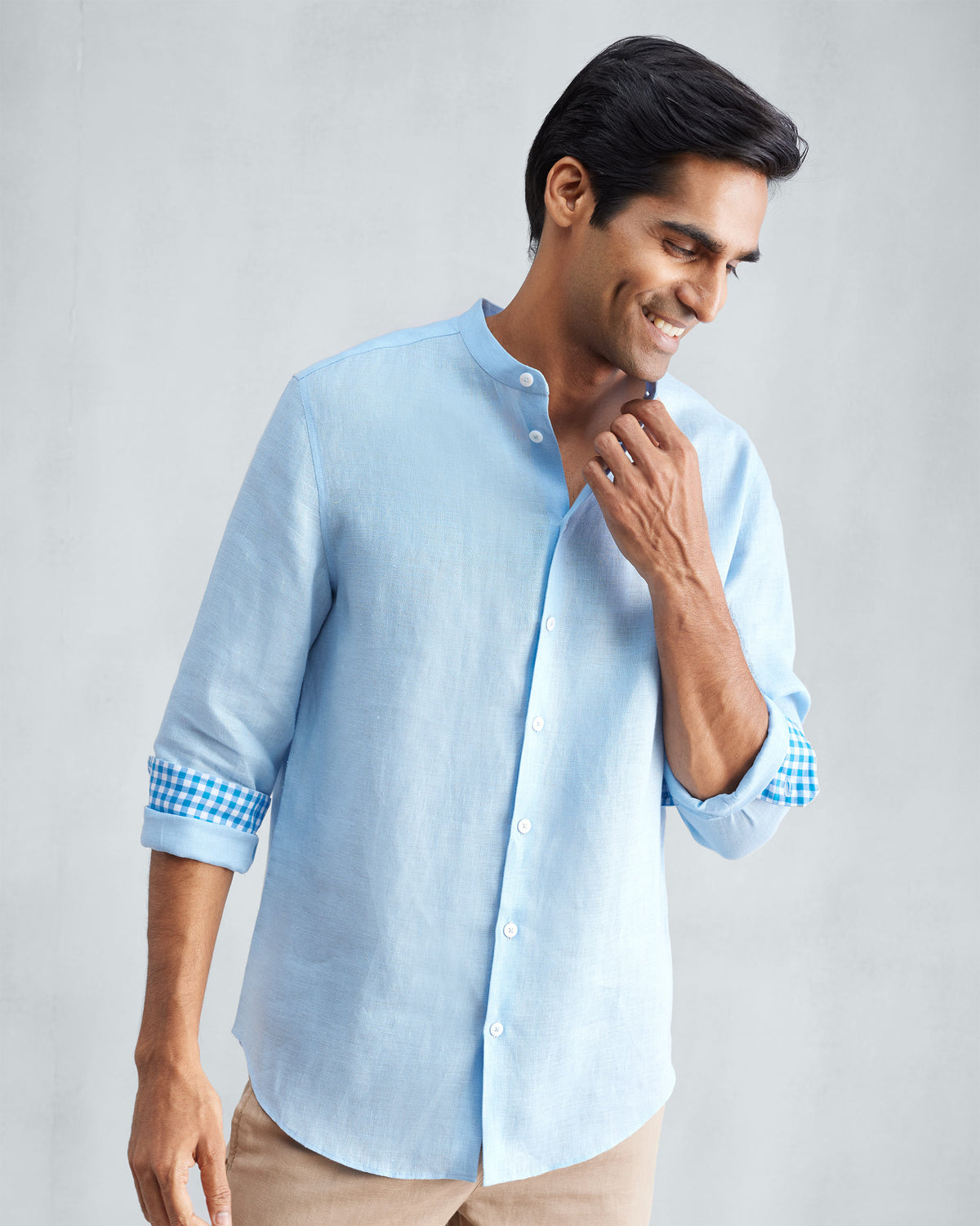 Light blue Nawab shirt with a Nehru collar and contrasting gingham cuff lining.