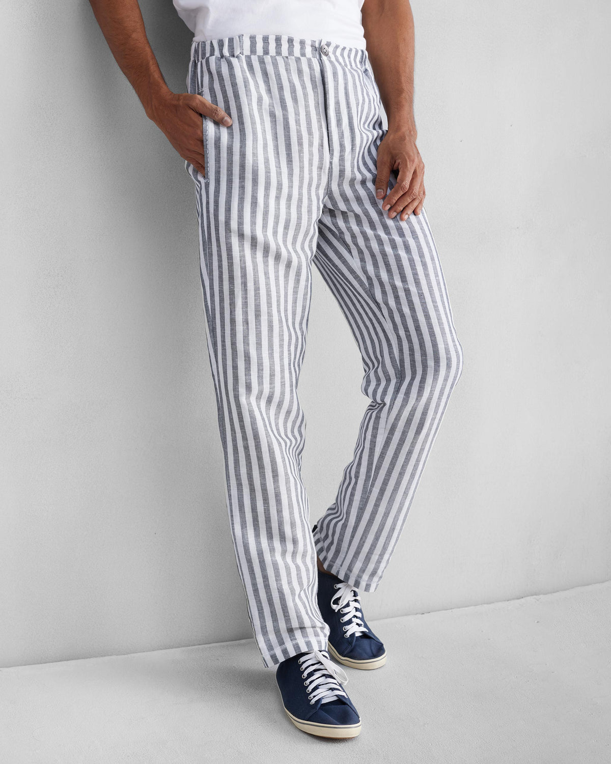 Person wearing charcoal and white striped Shillong jammies.
