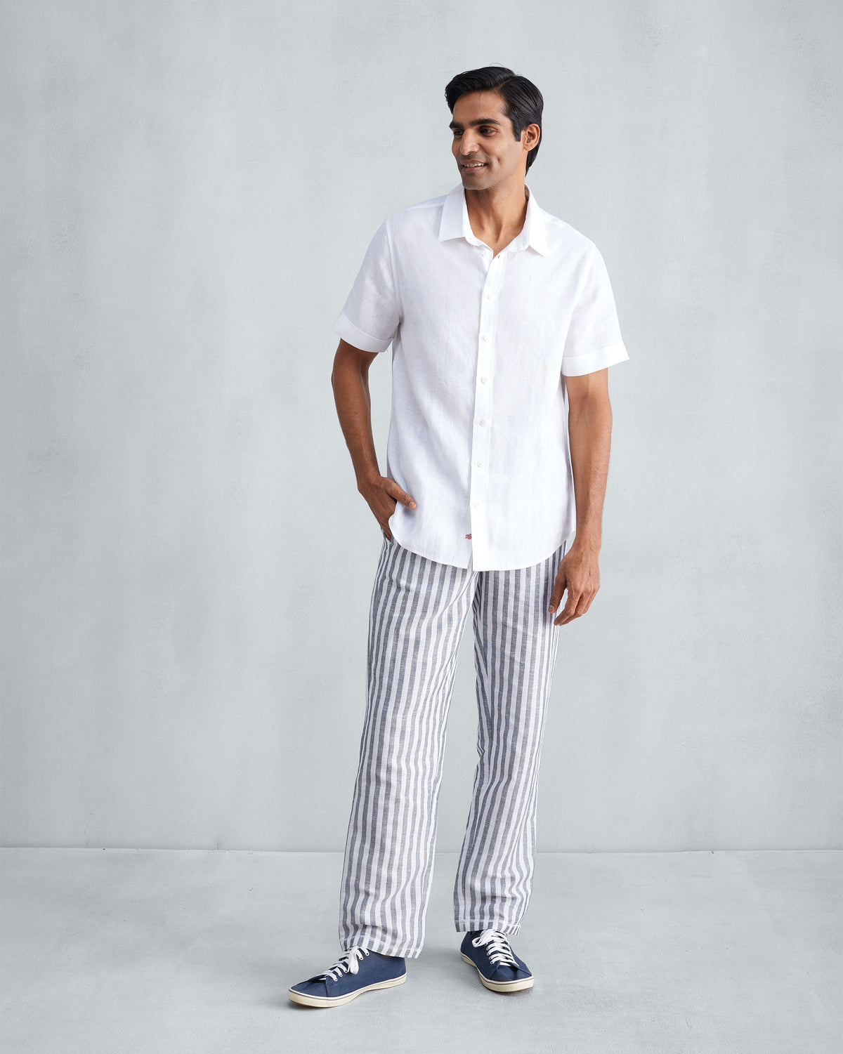 Charcoal and white striped Shillong jammies worn full length.