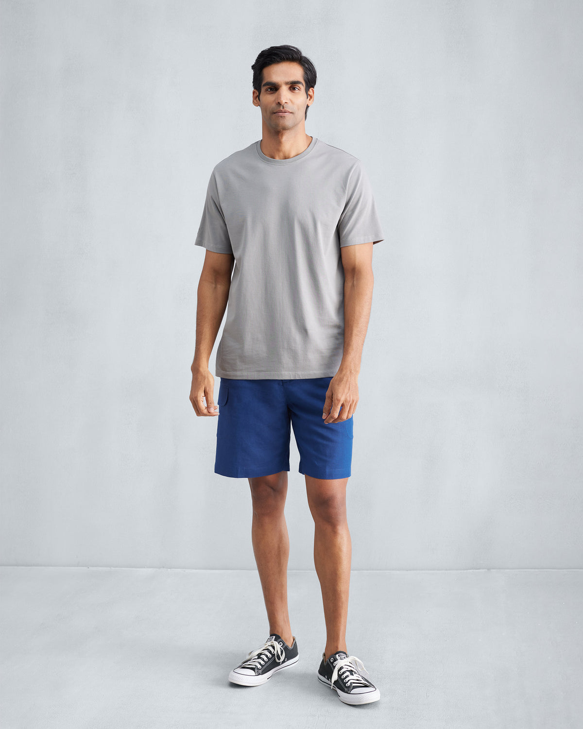 Person wearing navy Classic Shorts with a side cargo pocket.