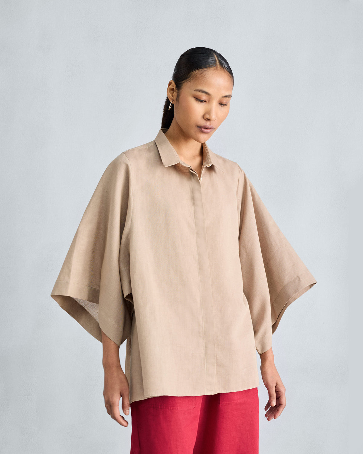 Beige drop armhole shirt with dramatic wide sleeves and a boxy fit.