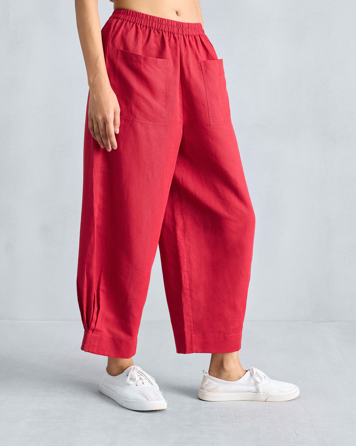 Person wearing red wide-leg cropped pants with an elastic waist.