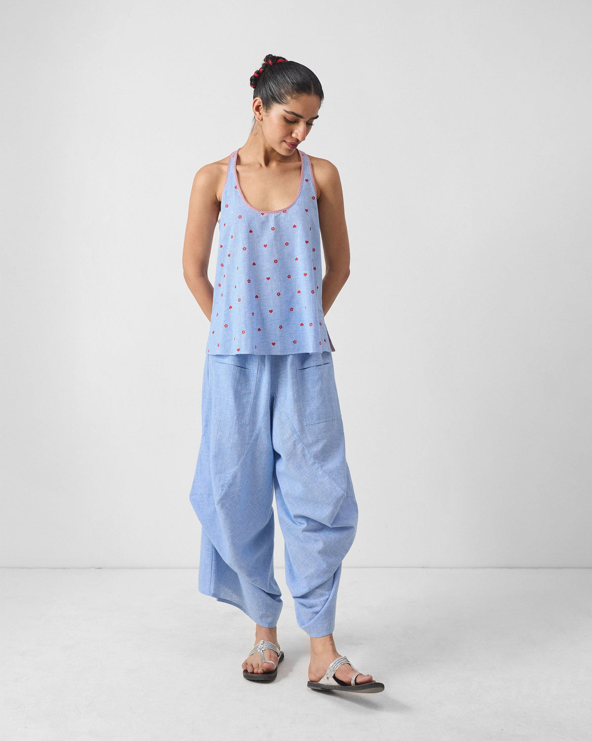 Blue and white checked Yoka trousers with a draped, cropped silhouette.