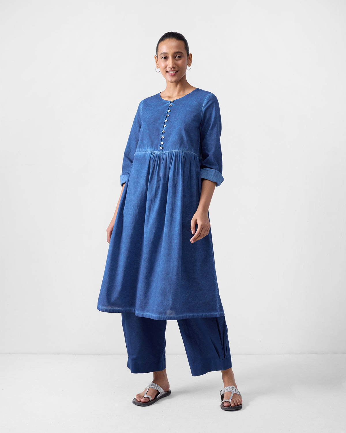 Person wearing a blue Geisha Kurta with a gathered fit-and-flare silhouette.