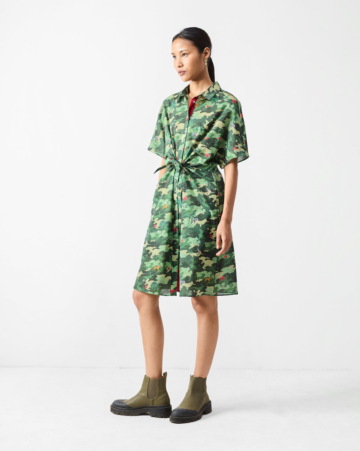 Person wearing a knee-length green printed Alappuzha Shirt Dress.