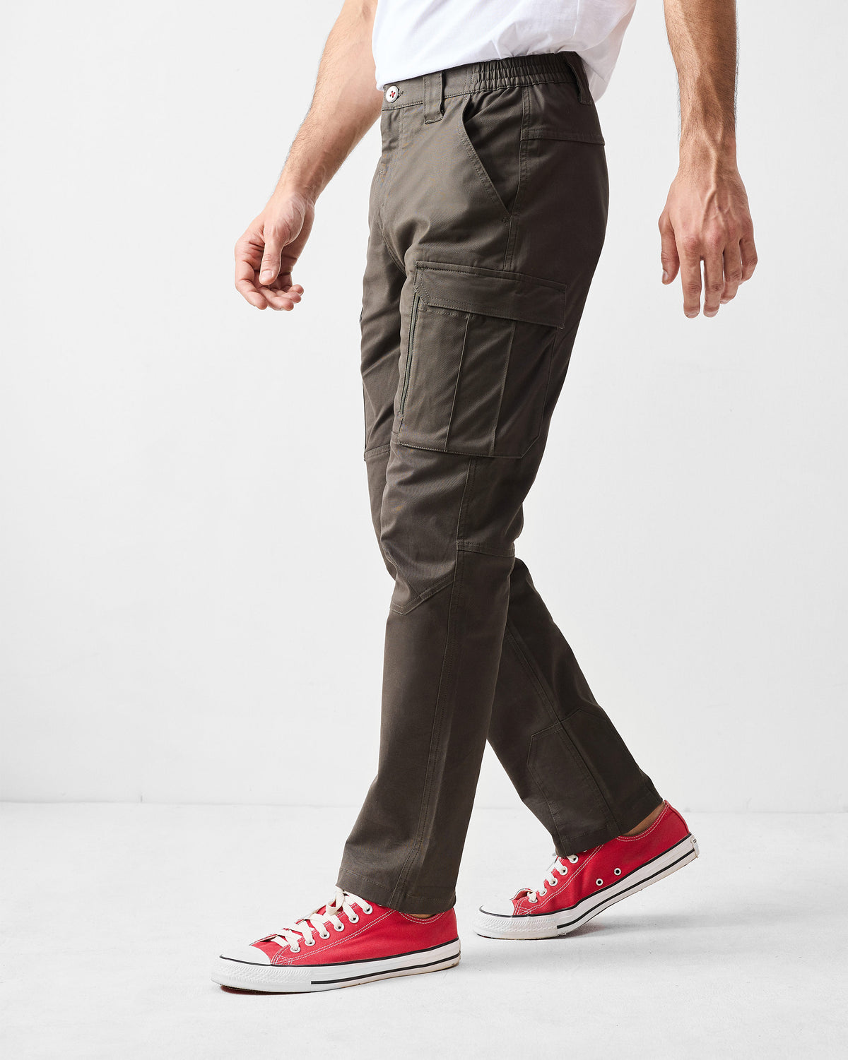 Side view of deep olive Boscage pants showing a flap cargo pocket.
