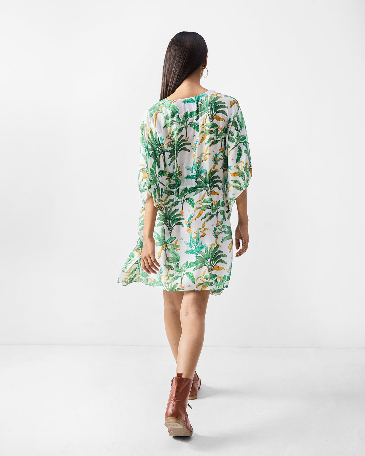 Back of a white Munnar Kaftan with a green palm print.