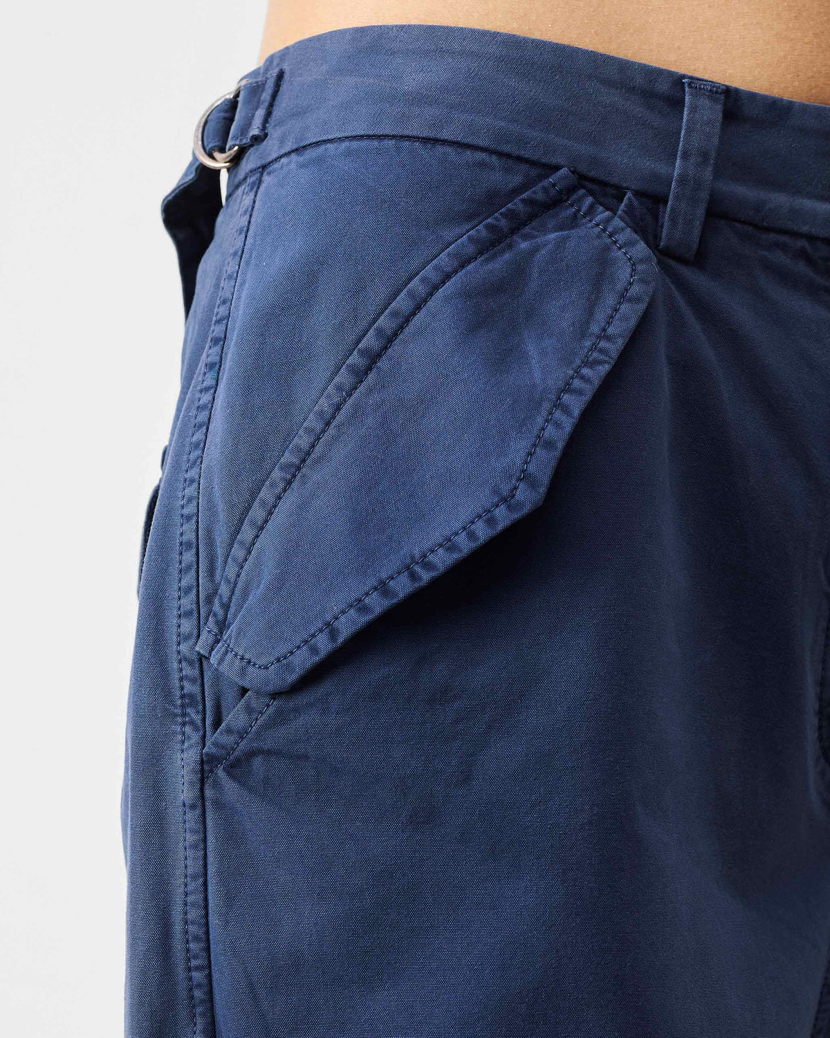 Close-up of the hip pocket and side D-ring adjuster on navy Vellore capris.