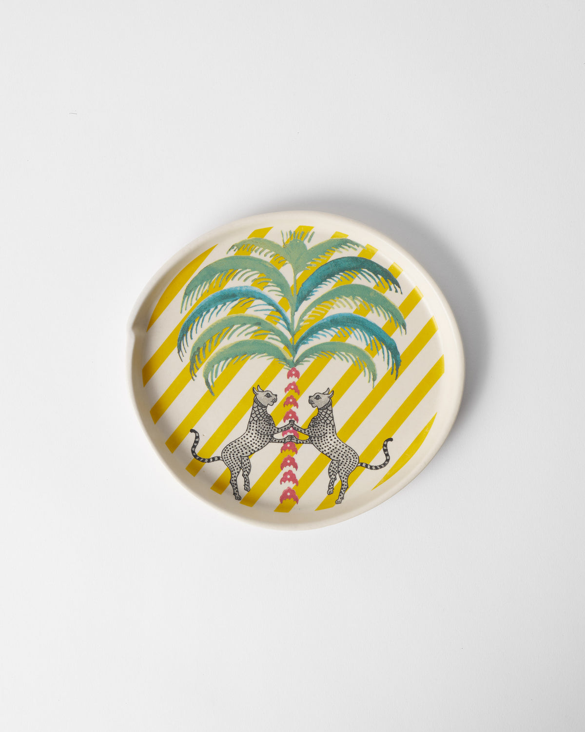 Overhead view of Bagh dessert plate with a palm and two leopards.