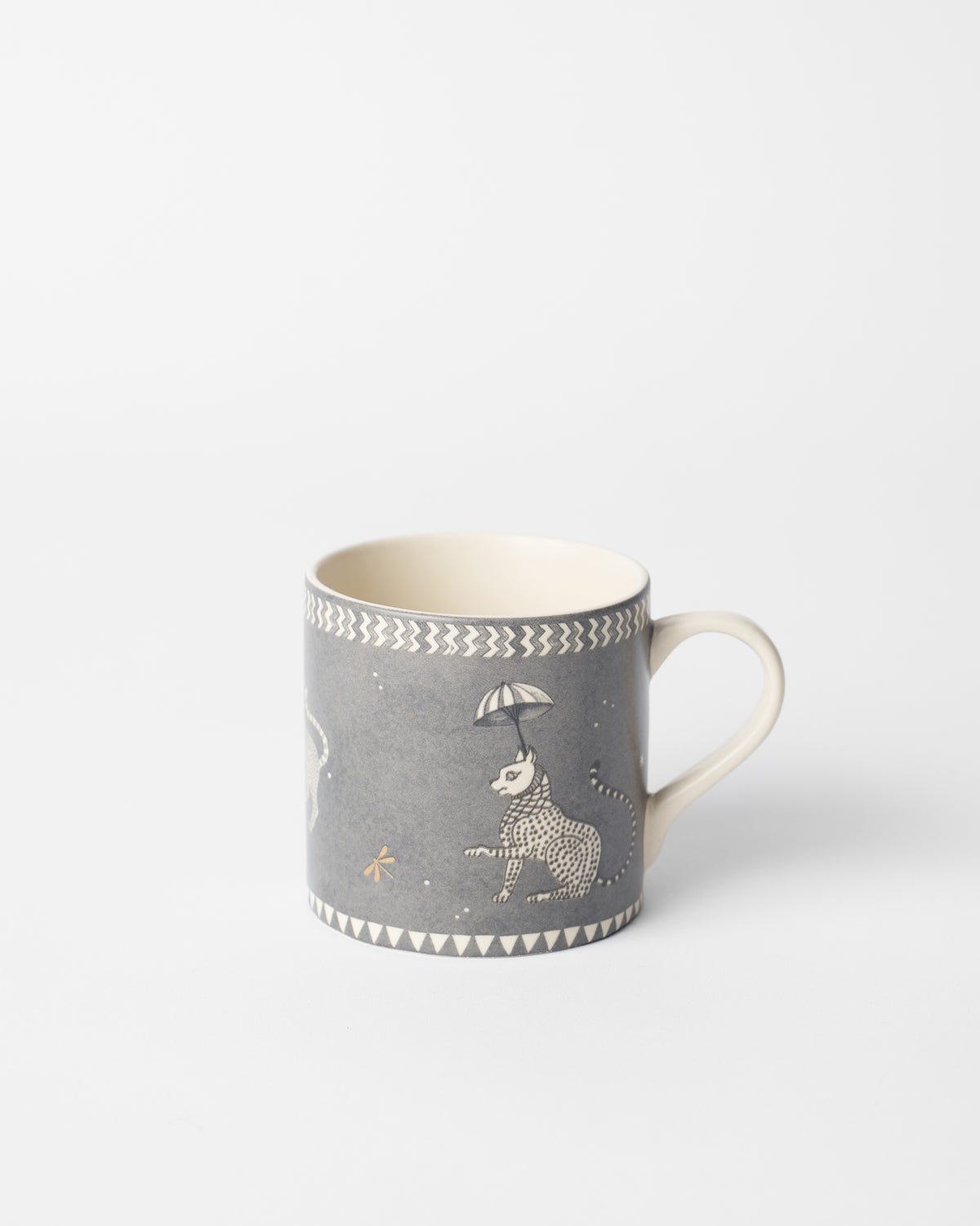 Bagh straight mug with a leopard under an umbrella on grey.