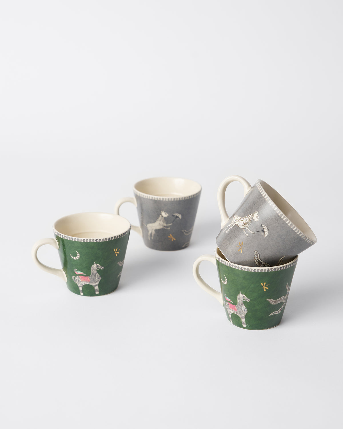 Indus espresso mugs in green and charcoal with horse motifs.