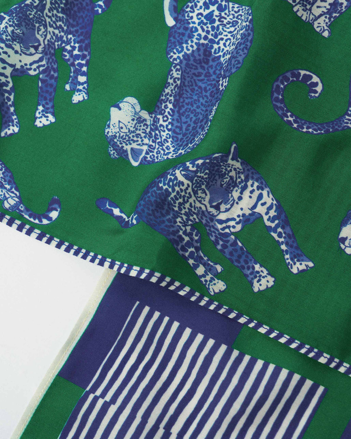 Close-up of panthers on a green Baagh Pocket Square.