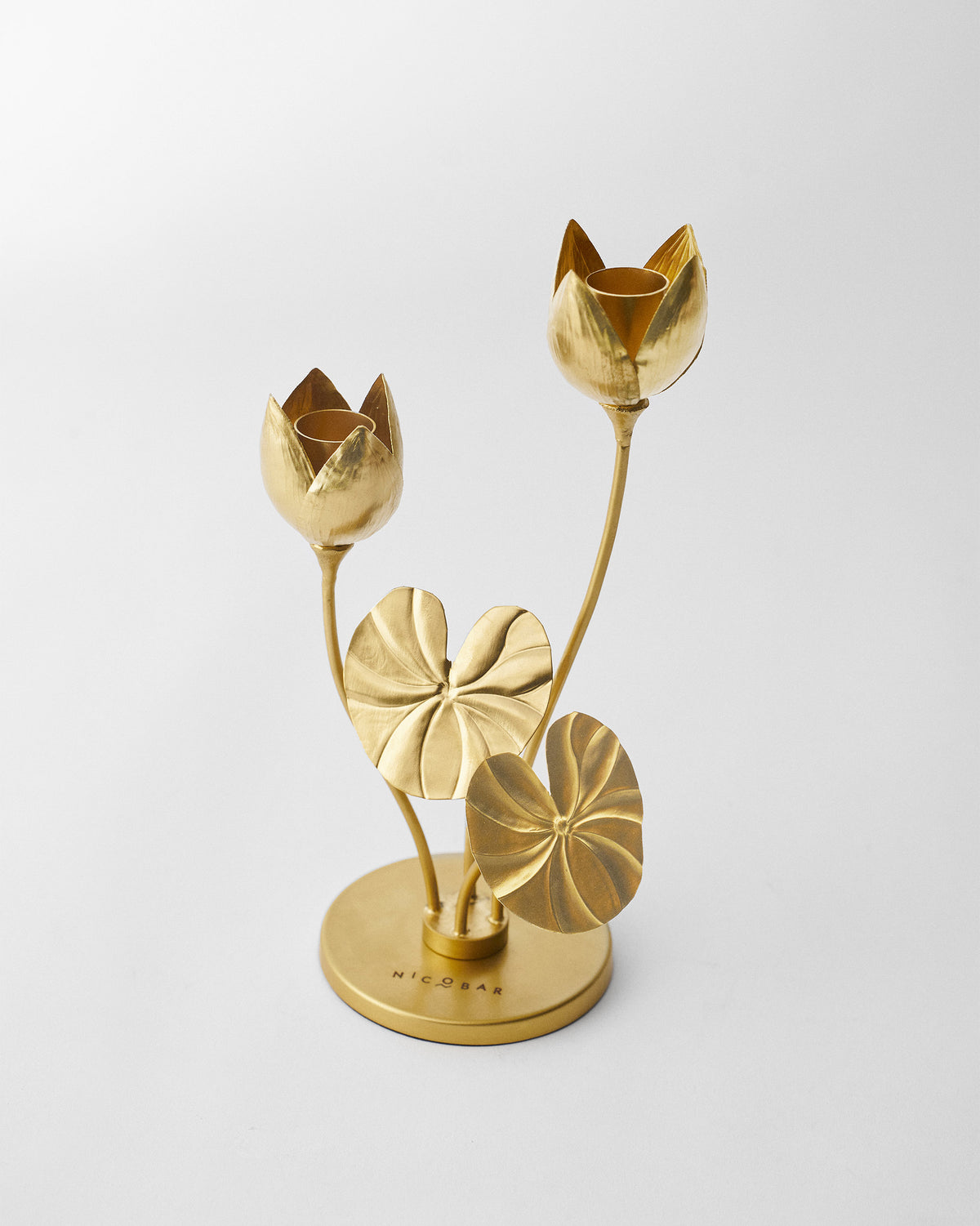 Island Lotus candle holder showing dual lotus cups and lily pad stems.