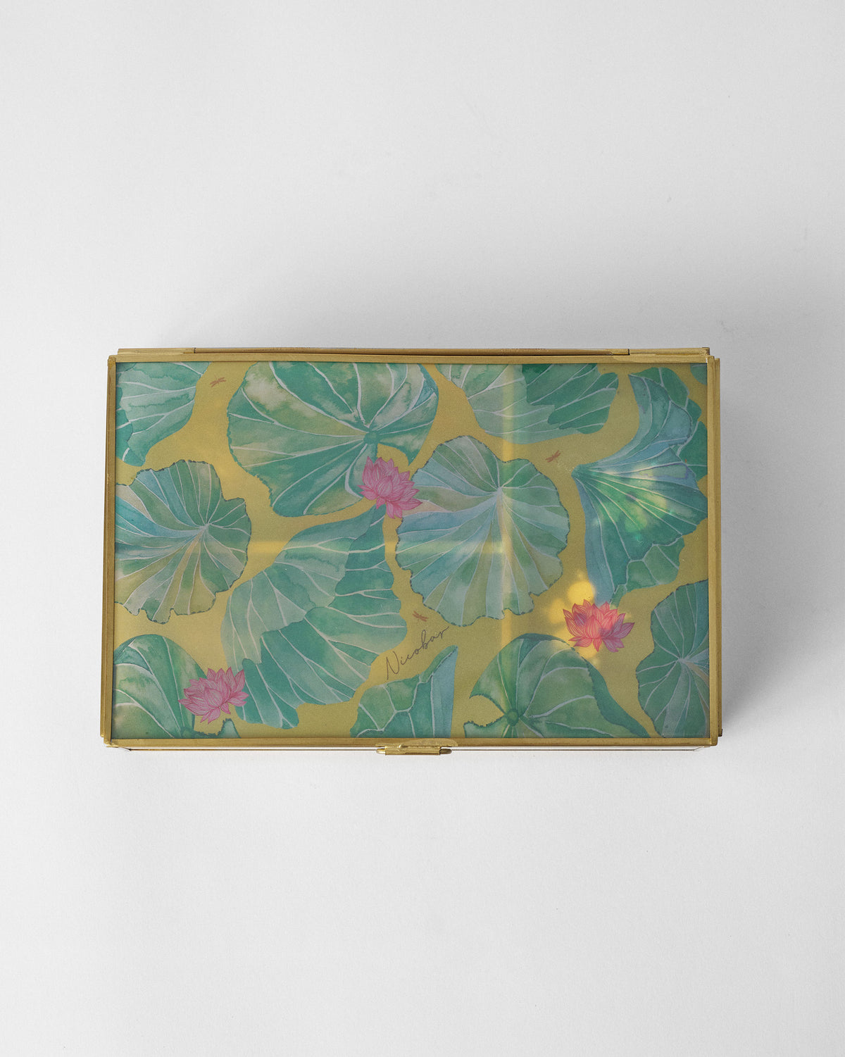 Lilly pond jewellery box lid with a lily pad print.